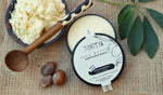Unrefined shea butter in a wooden bowl with natural shea nuts
