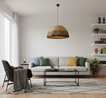 Handwoven basket ceiling lamp hanging from a ceiling, casting natural light in a cozy yet modern living room.