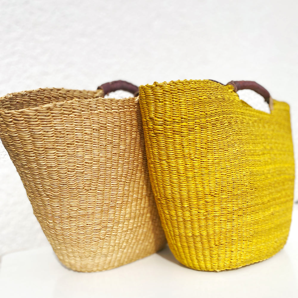 
                  
                    Unique structured Bolga basket tote with leather handles, handmade by Ghanaian weavers
                  
                