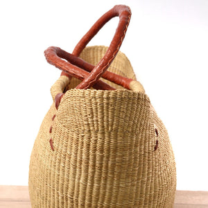 
                  
                    woven shopping basket natural color on wooden surface
                  
                