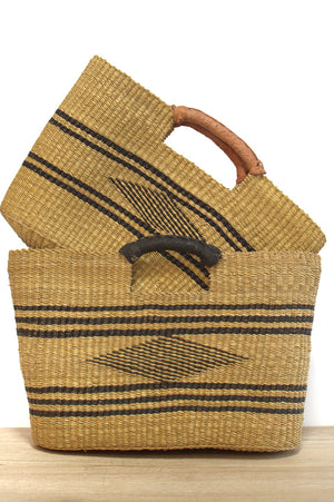 
                  
                    two natural and black bolga rectangular handgas with leather straps
                  
                