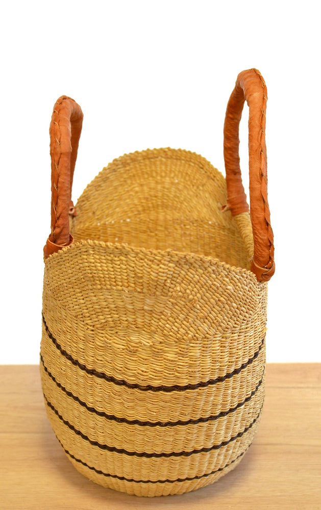 
                  
                    straw striped basket with brown leather handles 
                  
                