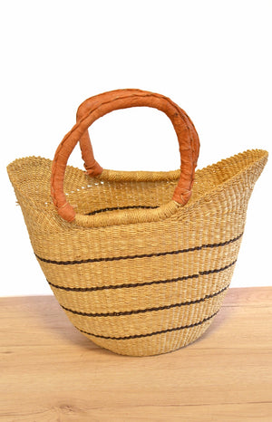 
                  
                    straw striped basket with brown leather handles 
                  
                
