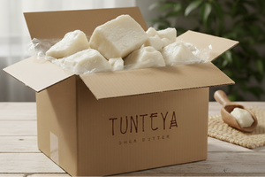 
                  
                    Box of Tunteya sheep butter on a wooden table with a plant in the background
                  
                