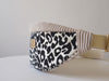 a product video showcasing a leopard print fanny pack by afrikatja