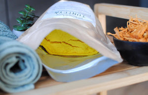 
                  
                    yellow shea butter packed in zippered bag
                  
                