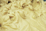 close up of creamy ivory colored shea butter